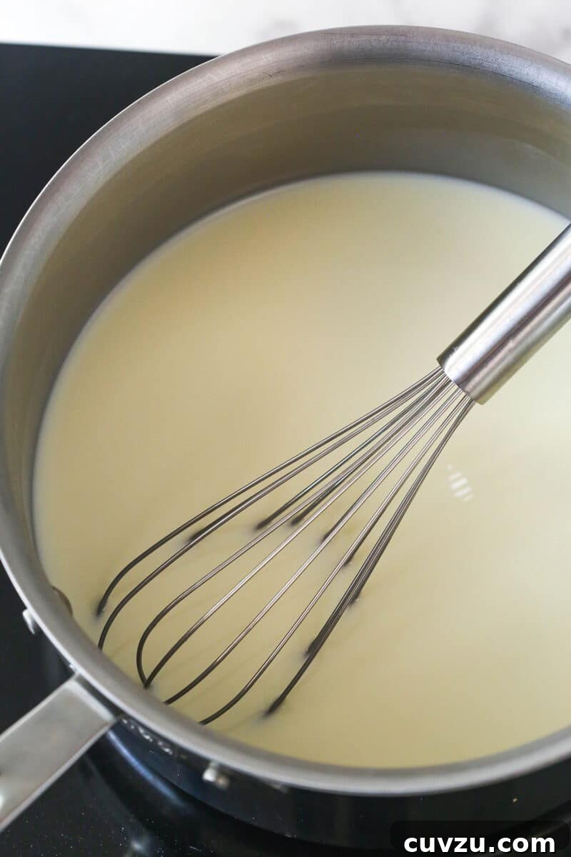 Magnolia Bakery-Style Banana Pudding Recipe from Scratch 3 Whisking milk and sugar