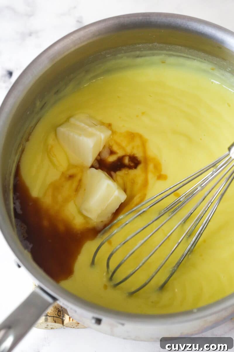 Magnolia Bakery-Style Banana Pudding Recipe from Scratch 7 Stirring butter and vanilla into pudding