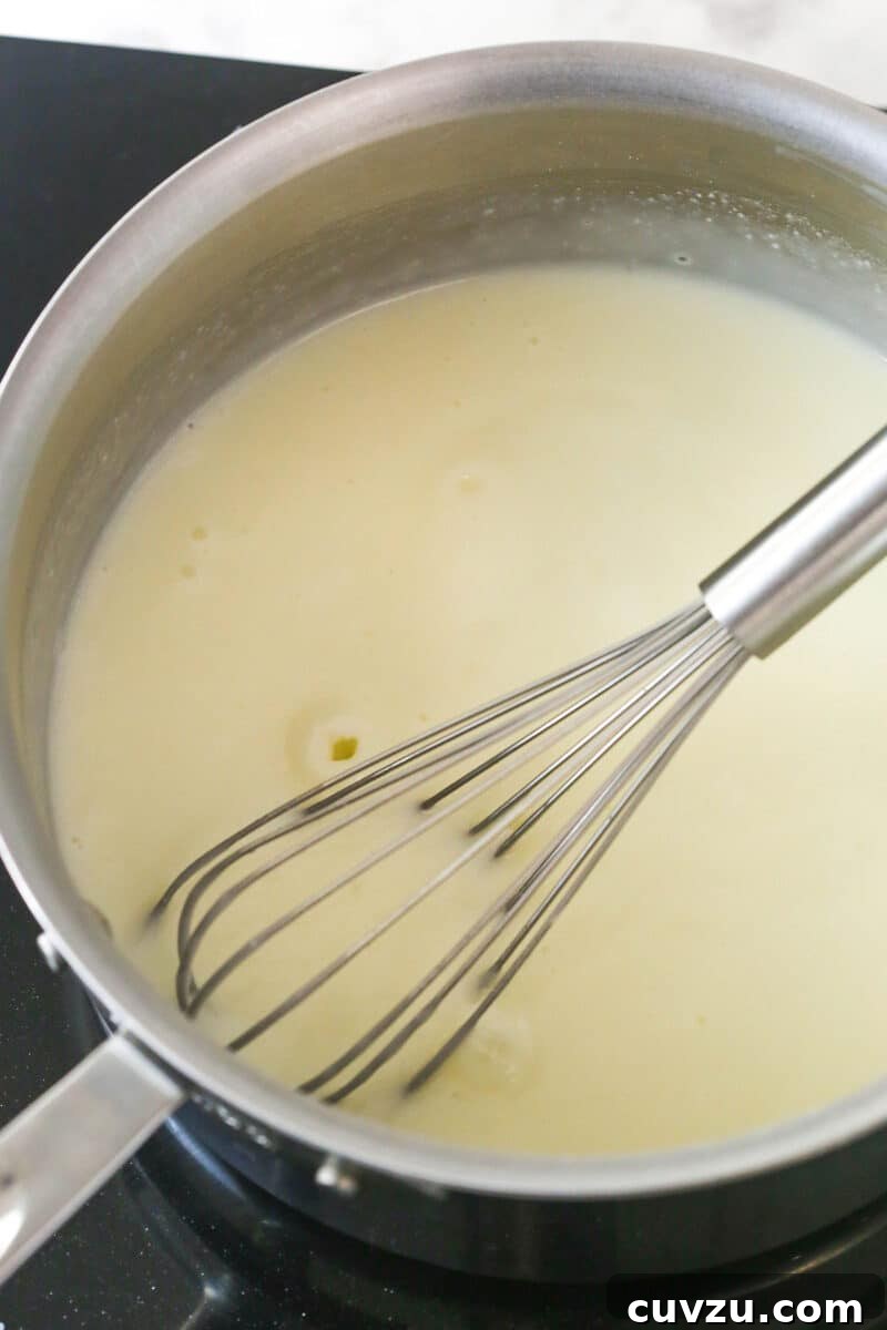 Combine cream, coconut milk, sugar and cornstarch and bring to a boil. Whisking the heavy cream mixture on the stovetop