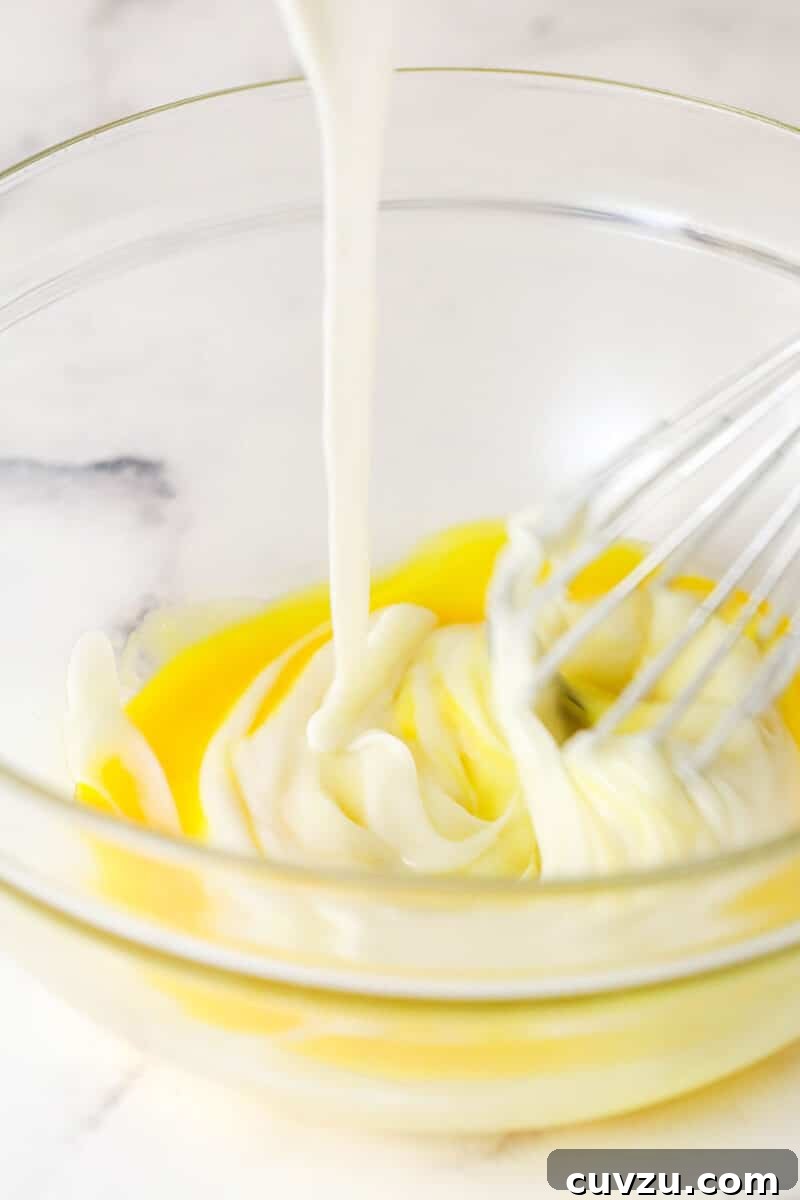 Temper the egg yolks with hot cream to avoid scrambling. Tempering eggs with a bit of hot cream