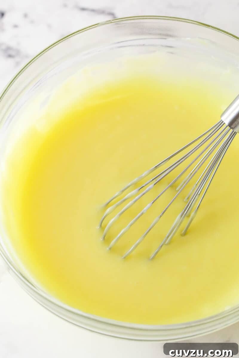 Whisk until smooth. Whisking tempered eggs